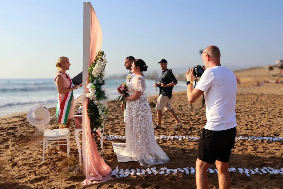 Behind the scenes at a beach ceremony