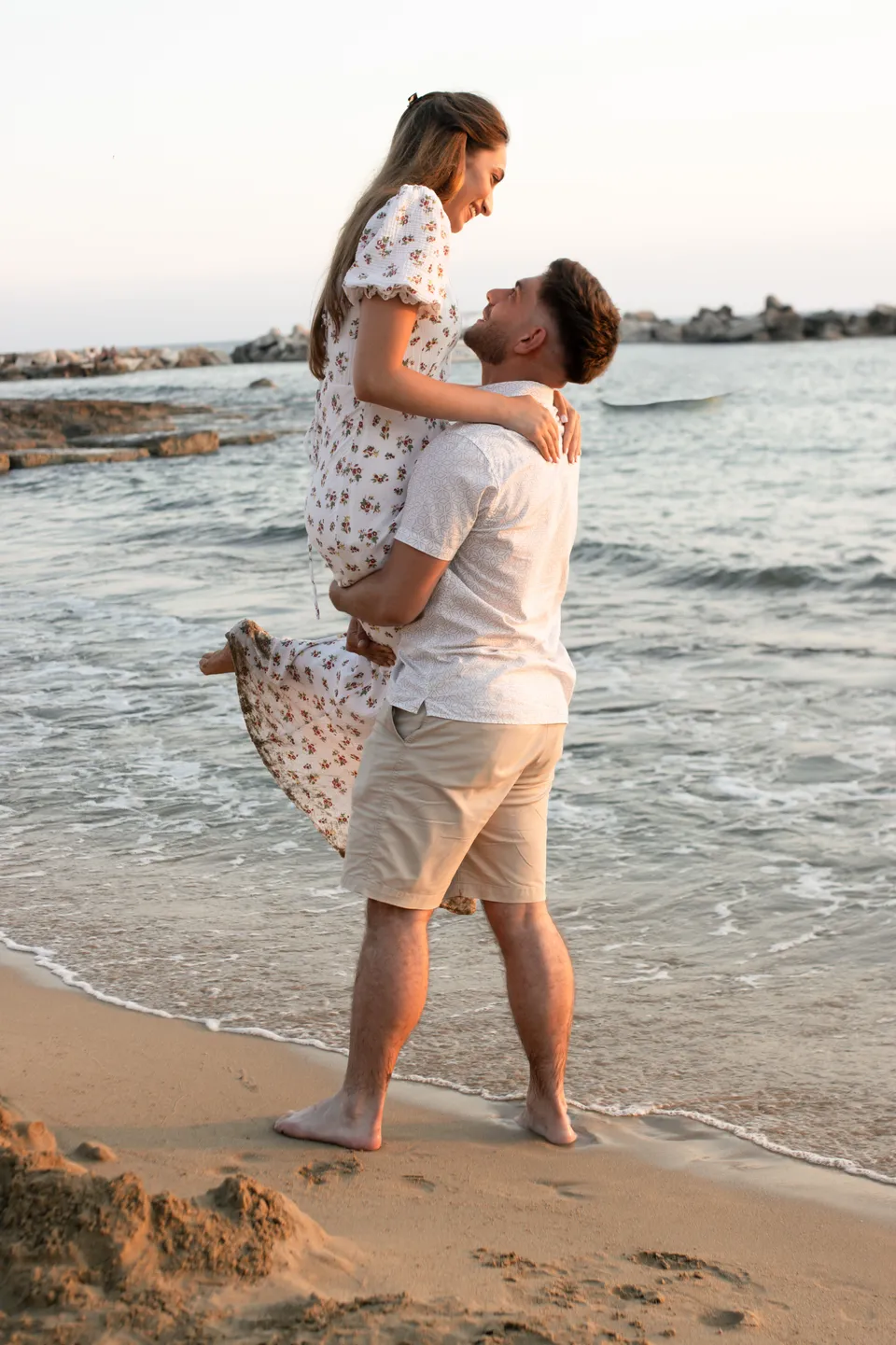 He lifts her at the waterline