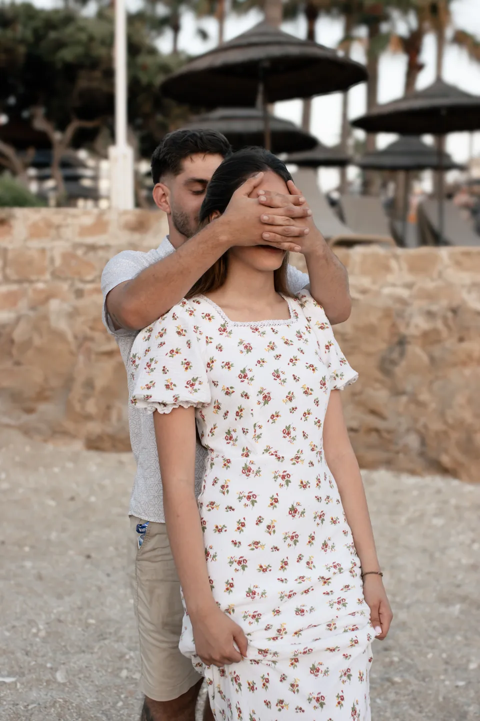A surprise: hands over her eyes