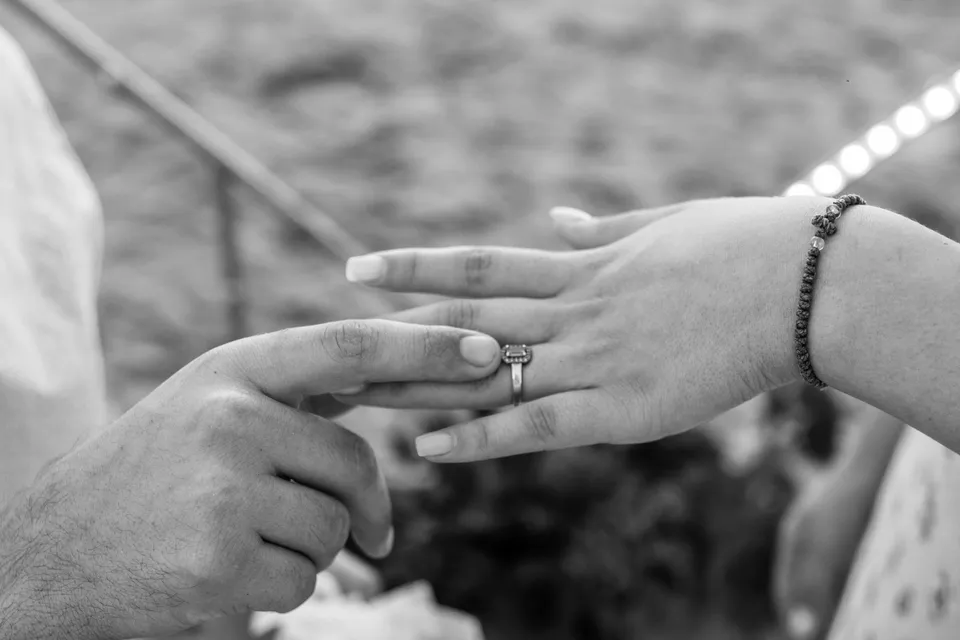 Hands and ring in black and white