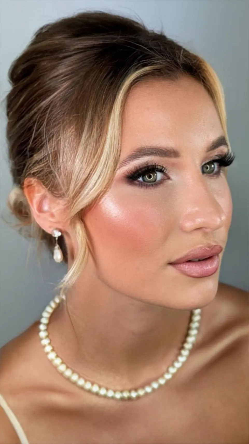Soft updo with face framing strands