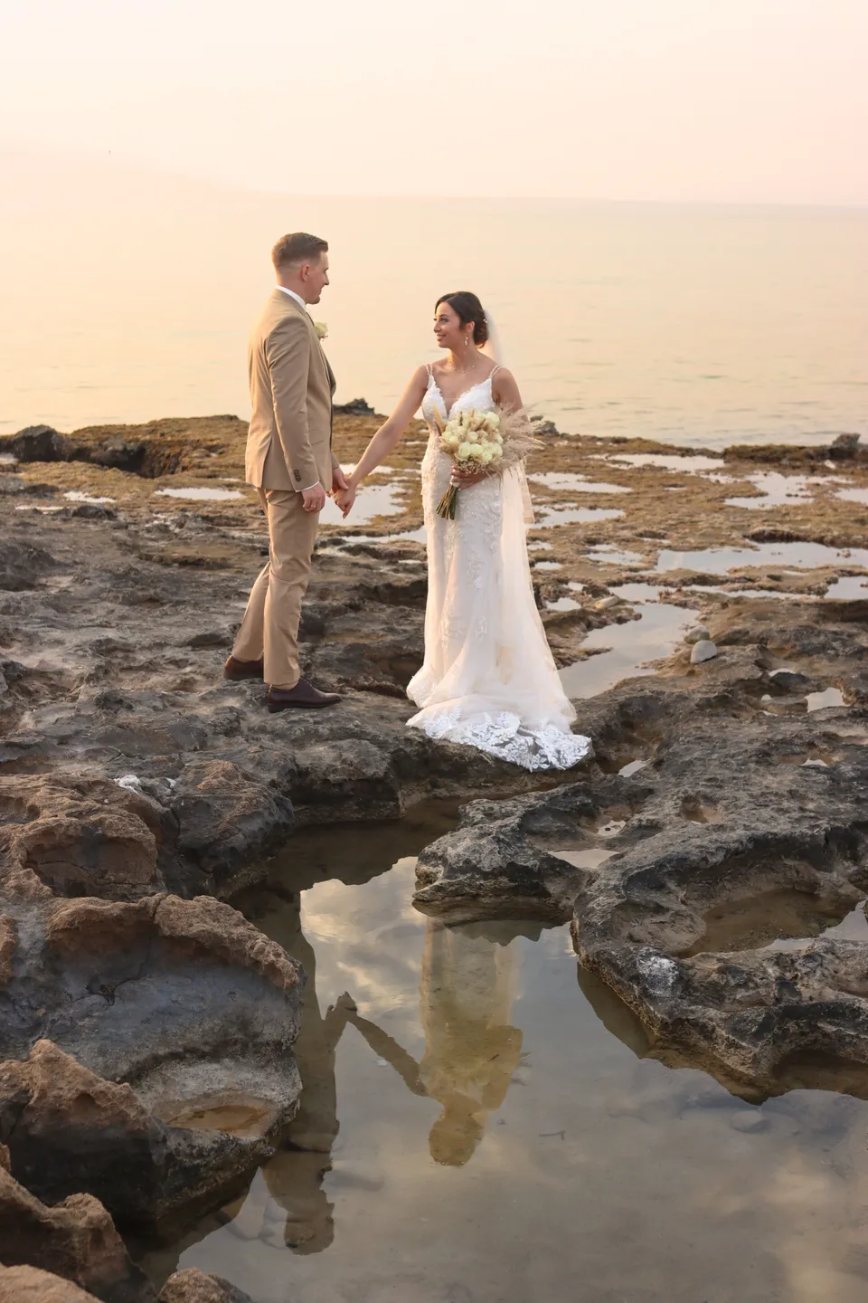 Couple on the rocks at golden hour