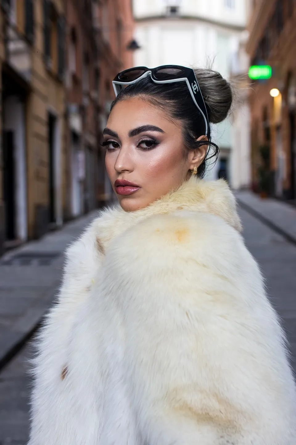 Fur coat in a narrow street